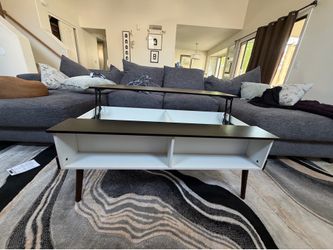 Coffee Table with folding top and storage.
