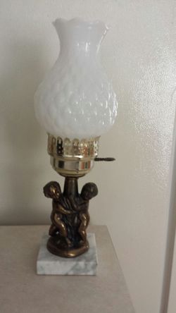 Hurricane style lamp w/ milk glass globe, brass cherubs on a marble base