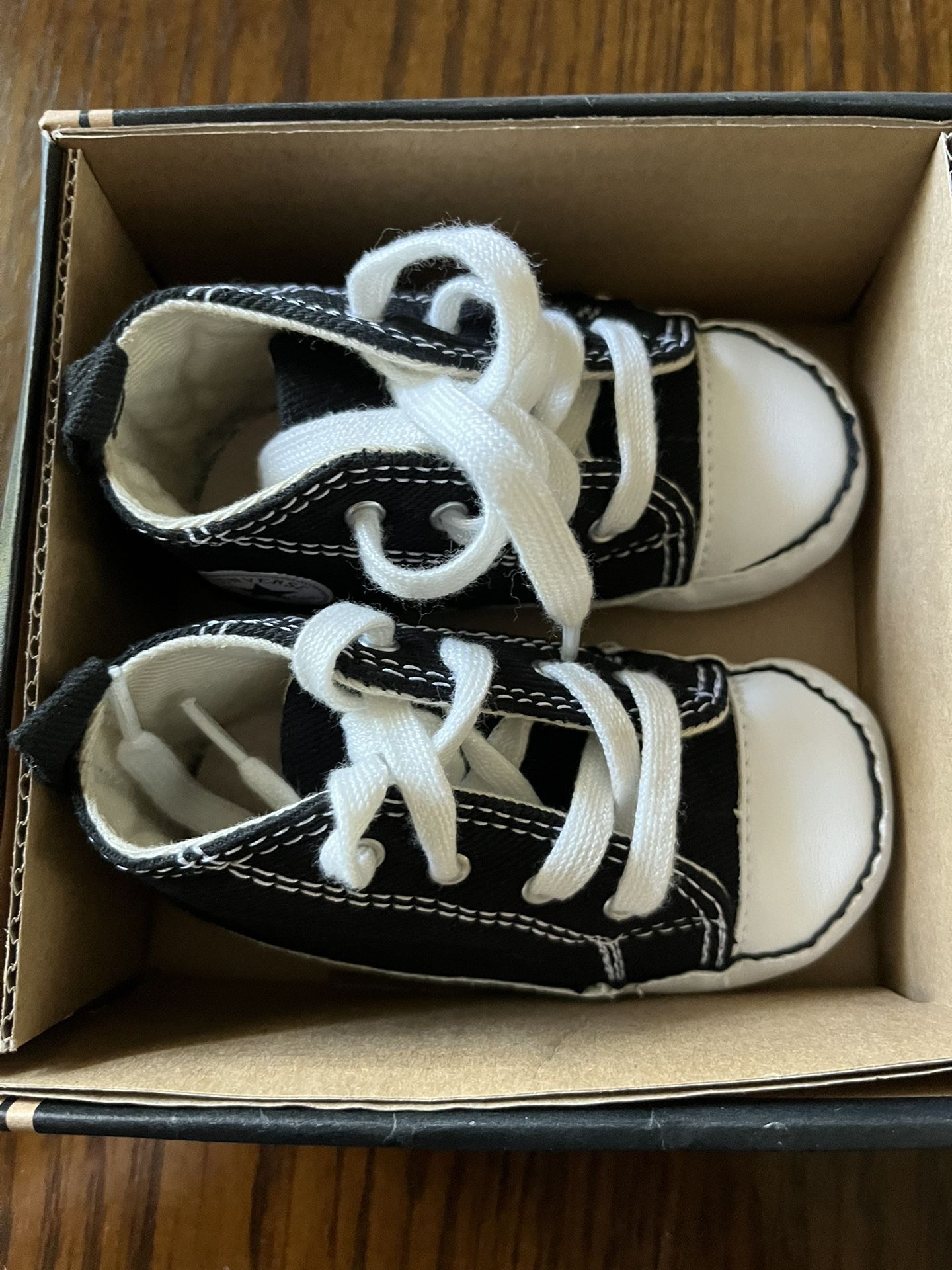 There Very Cute CONVERSE little Shoes For Little Boy. The Size Is 4 The Color Is Black And White Never Been Used