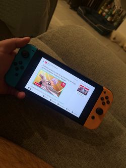 Nintendo Switch with Neon Blue and Orange Joy-Cons