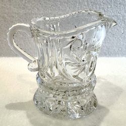 Antique creamer pitcher cut glass.  Pinwheel pattern 