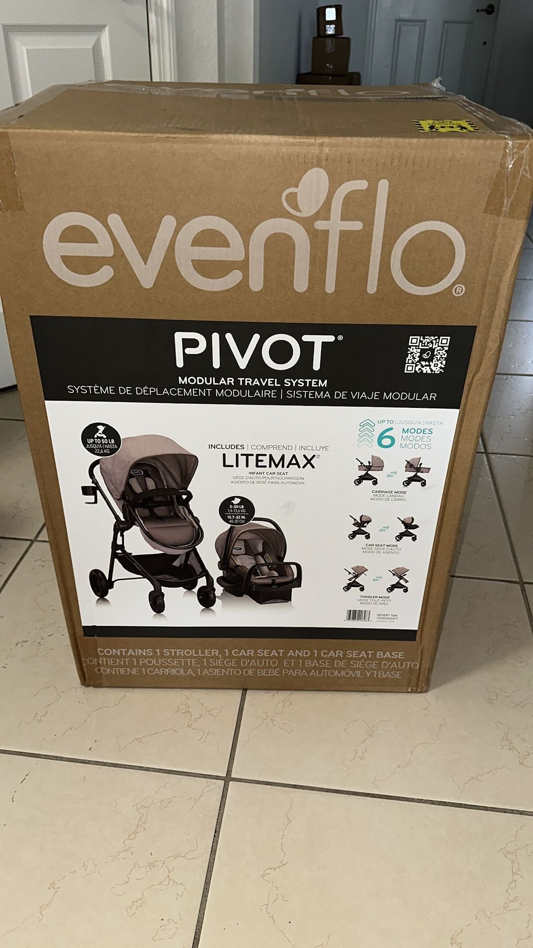 Coche para bebé Evenflo Pivot con silla de auto NUEVO