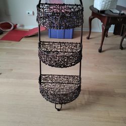 Three tier storage basket