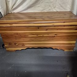 WOOD CEDAR HOPE CHEST WITH SHELF. THE SMELL OF CEDAR INSIDE/ VERY HEAVY/ NOT FREE GIVE OFFER