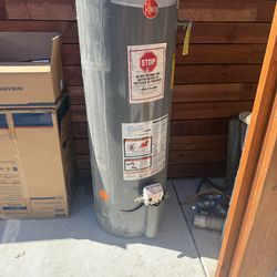 Water heater with metal enclosure
