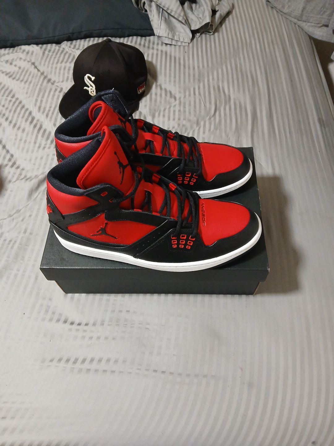 Nike Air Jordan 1 Flight sneakers in a black and red "Bred" colorway. Size 12 men