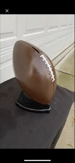 Life-size football coin, bank statue