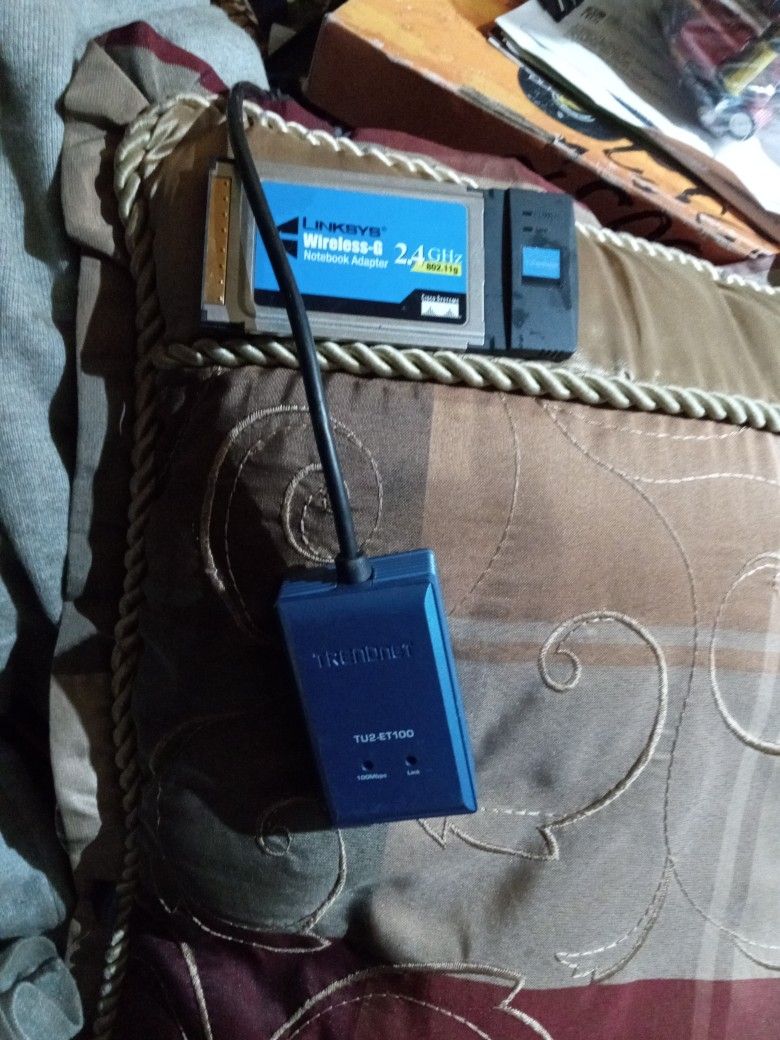 Lexi Wireless G Notebook Adapter 2.4 Gig That Hurts And Trinidnet Router I Think Not Sure What It Is