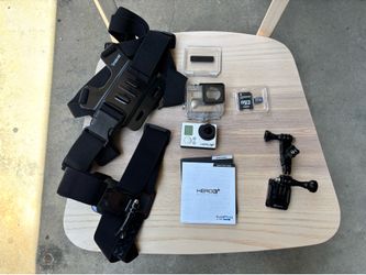 GoPro Hero 3+ Black Edition action camera with accessories (SD card, case, chest & head rig)