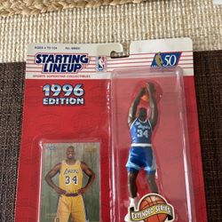 Vintage 1996 Starting Lineup Shaquille O’Neal figure (Extended Series) by Kenner. This item is still factory sealed and includes the original trading