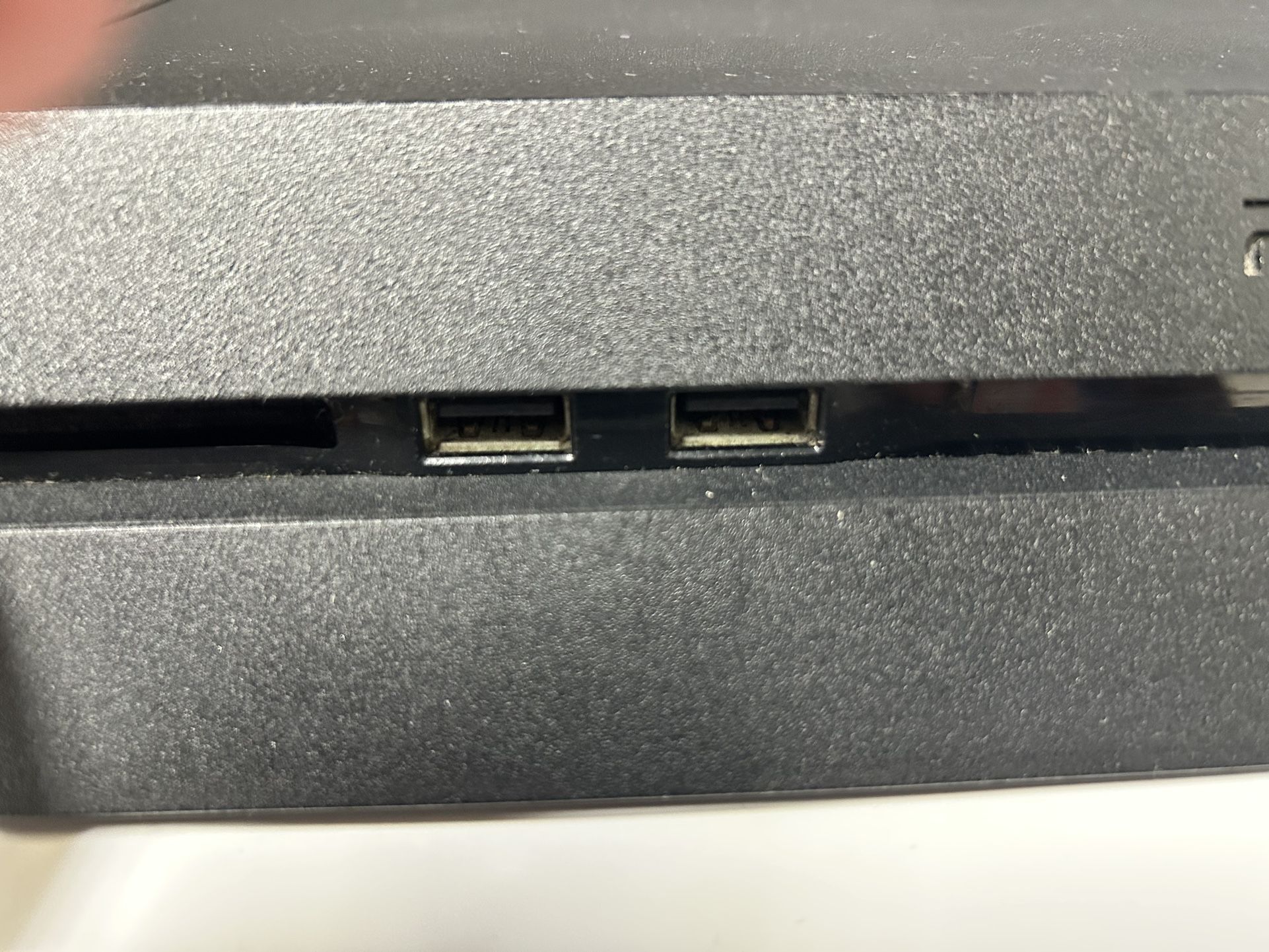 A PS4 Black Slim Console Including Game And Cords!