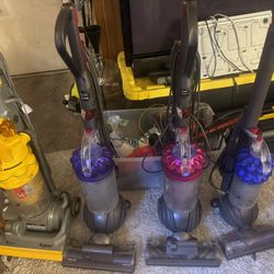 Dyson Vacuum Cleaners. Each