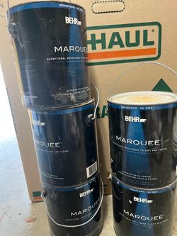 Five gallons of yellow exterior paint
