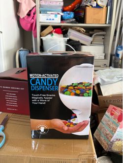 Motion activated candy dispenser