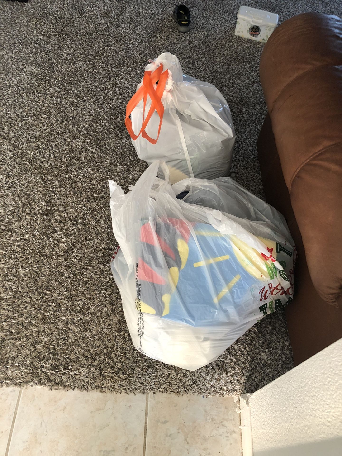 Two large bags filled with women’s stuff