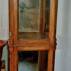Curio Cabinet With Glass Shelves And Interior Lighting