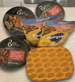 $5 Rachelle Ray , (2) Pedigree, (8) Pure Balance Grain free Dog Food