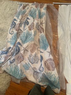 Shower curtains with liner in excellent condition . Used for couple months and then installed shower doors