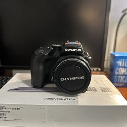 * Olympus SP-57OUZ 10MP digital Camera with 20x Optical dual image stabilized Zoom 