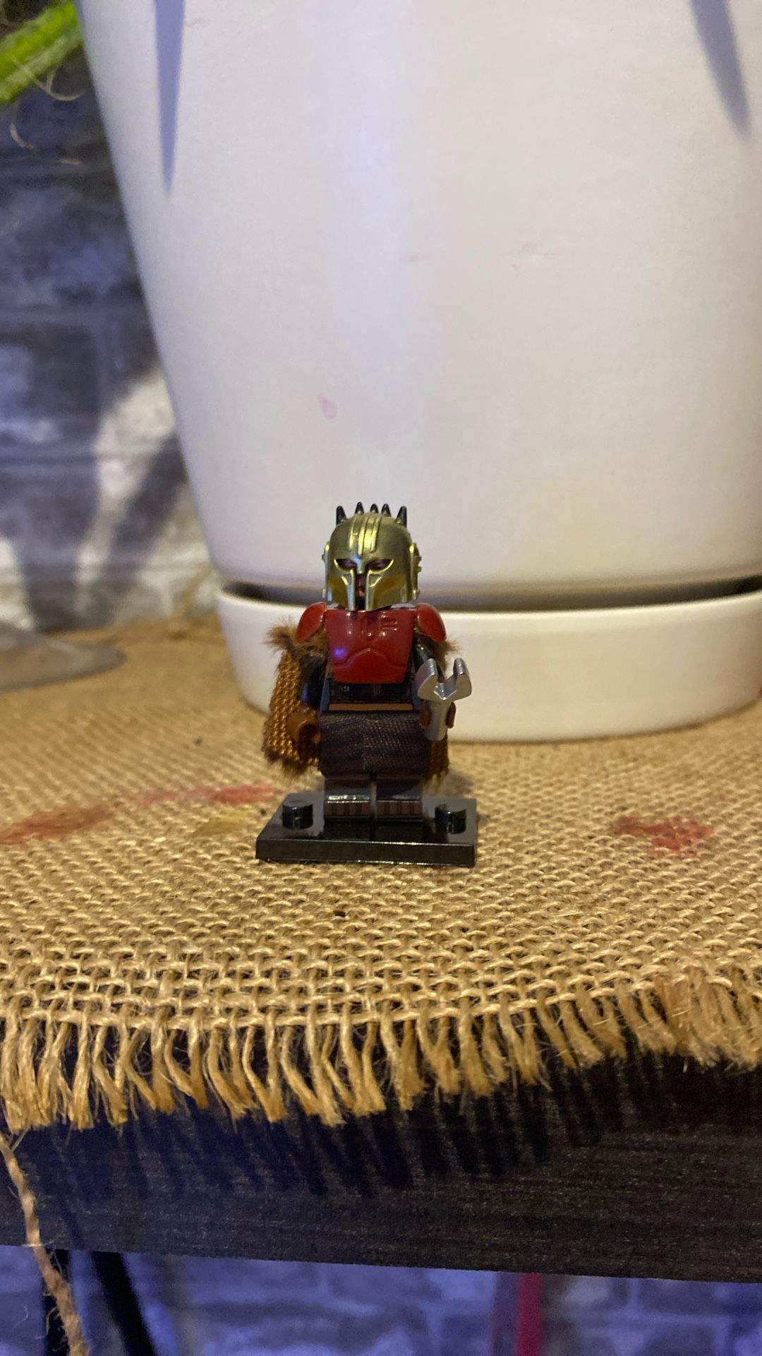 The Armorer is a skilled Mandalorian blacksmith Logo Figure