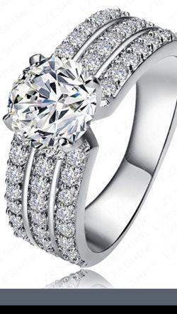 Brilliant cubic zirconia and sterling silver stamped 925 ladies ring size 6,8.