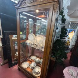 Light oak curio cabinet
