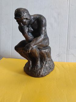 Bronze-toned decorative replica of Auguste Rodin’s iconic sculpture The Thinker