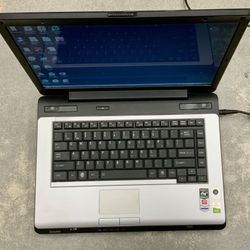 Toshiba Satellite A215 2007 Laptop Notebook Windows Vista AMD Athlon 64 X2 Dual Core Processor 2 GB RAM 141 Storage Memory Wifi Bluetooth Disc Drive 