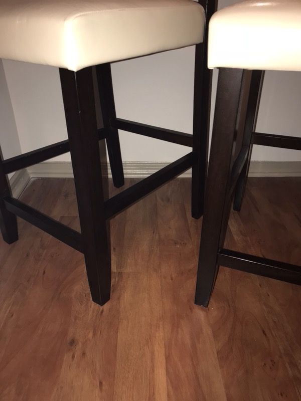2 white counter height bar stools