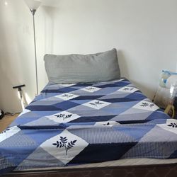 Full-size bed with mattress in very good condition.