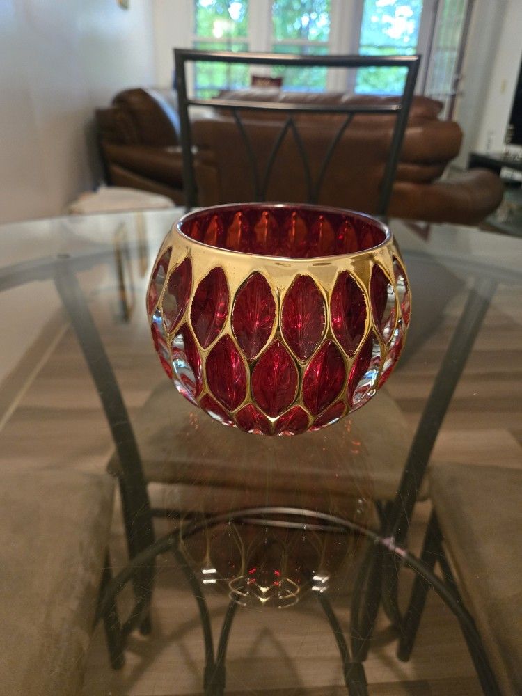 Red crystal vase which can also be used as candle holder; NOTE: If it's posted; it's available.