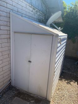 2 metal storage sheds (4x7) plus metal shelves