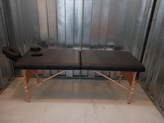 Portable wooden massage table good condition.