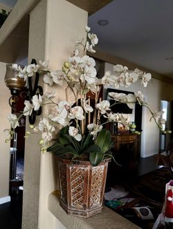 large artificial white phalaenopsis orchid arrangement in a decorative planter. 
