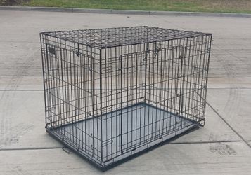 Large double door crate                                                         sturdy condition  , slight rust underneath the plastic tray .         