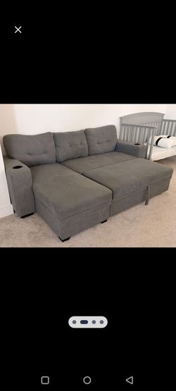 L shape gray sectional with storage chaise and cup holders