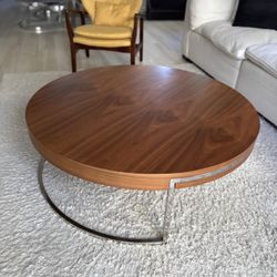 Round wood coffee table with metal base