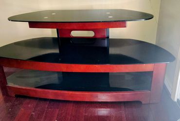 Glass and wood tv stand $50 can hold up to 50" tv obo