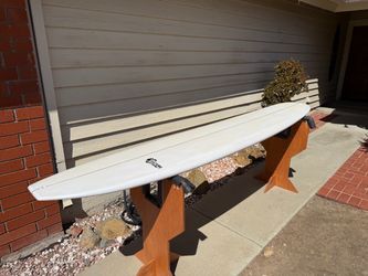 NEW unwaxed Culture Supply Log Ride 10’0 EPS longboard surfboard with a 2+1 fin setup.