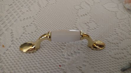 Cabinet handles 22. 3 inch ( hole width. Brass ( gold and baige) cabinet handles