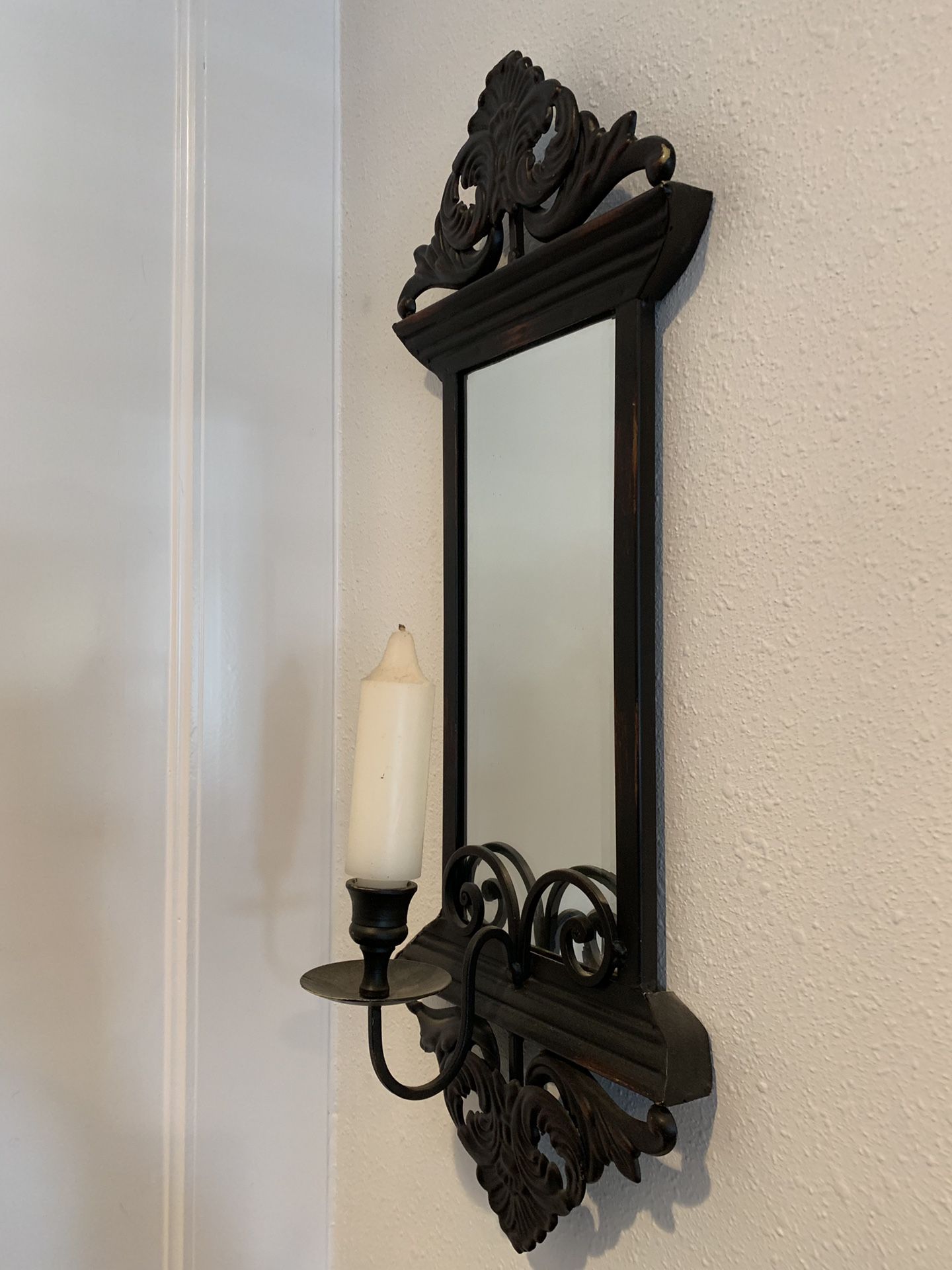 Black wall mount candle holder with mirror and candle