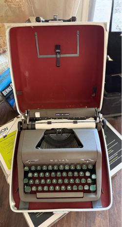 Royal Quiet De Luxe portable manual typewriter in hard case