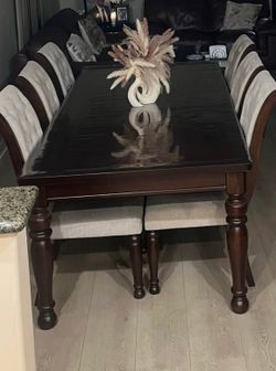Dark wood dining table w/ 6 chairs