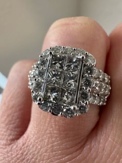 Macy’s Pristine, halo-inspired ring featuring round diamonds (2 ct. t.w.) set in 14k white gold