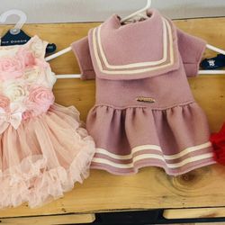 Medium size dog outfits three are brand new two pink ones used only ones