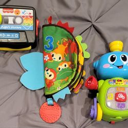 3 baby Toy lot: Soft Cloth Baby Book, Fischer Price Laugh & Learn Puppy Mix Tape + Vtech Robot