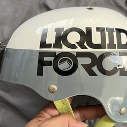 Liquid Force Water Helmet With A GoPro Mount And Leash. Black,White And Grey With A Safety Green Straps.