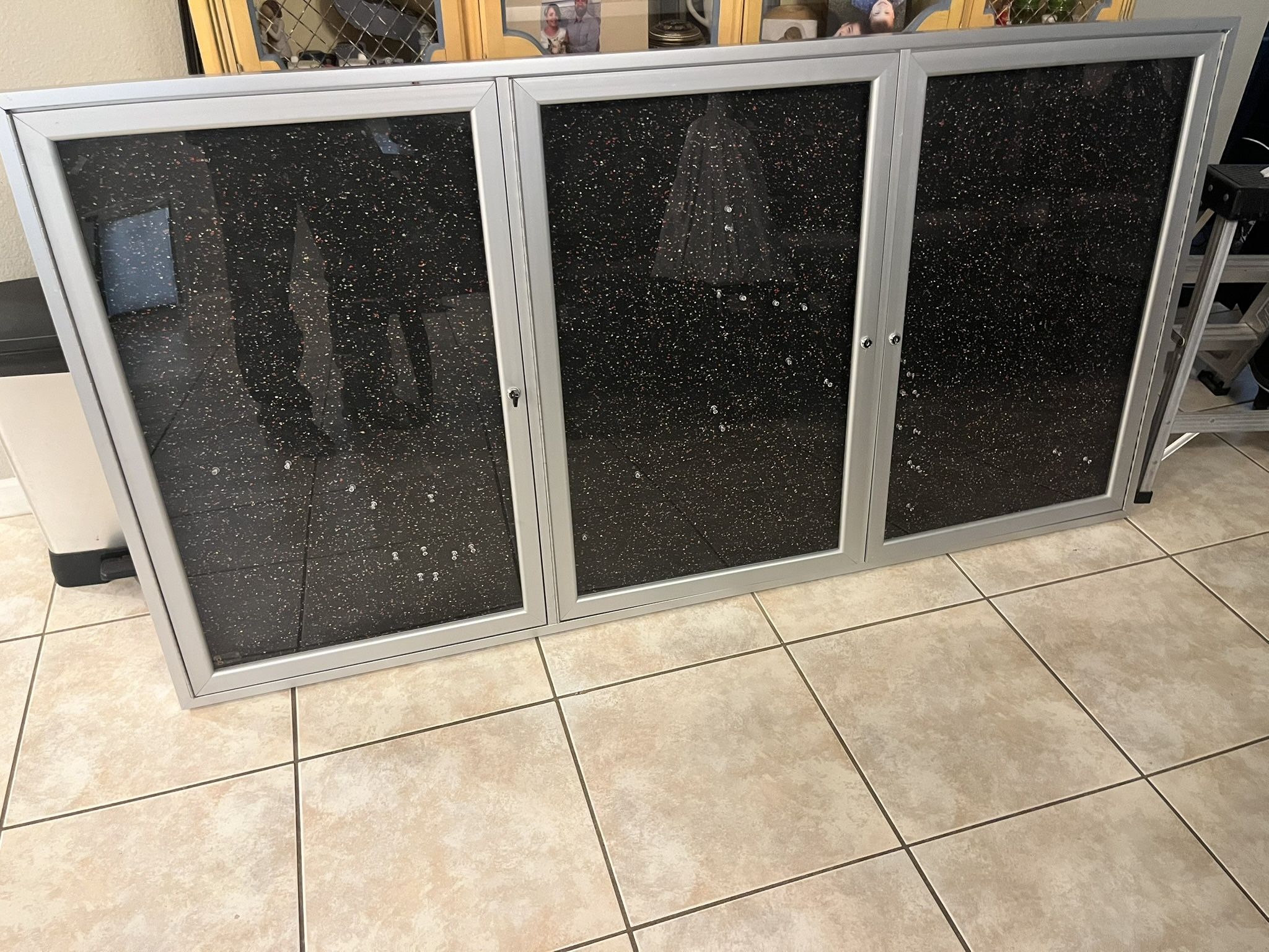 Enclosed bulletin board: $75