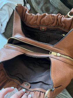 Coach Maya pebbled leather shoulder bag in brown.