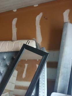 Black Framed Wall Mirror and King Size mattress and bedframe